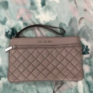 Michael Kors leather quilted clutch purse in grey.